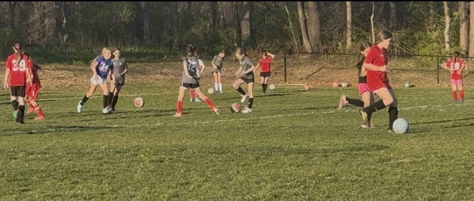 St. Louis Legends players learning through live game play on the field.